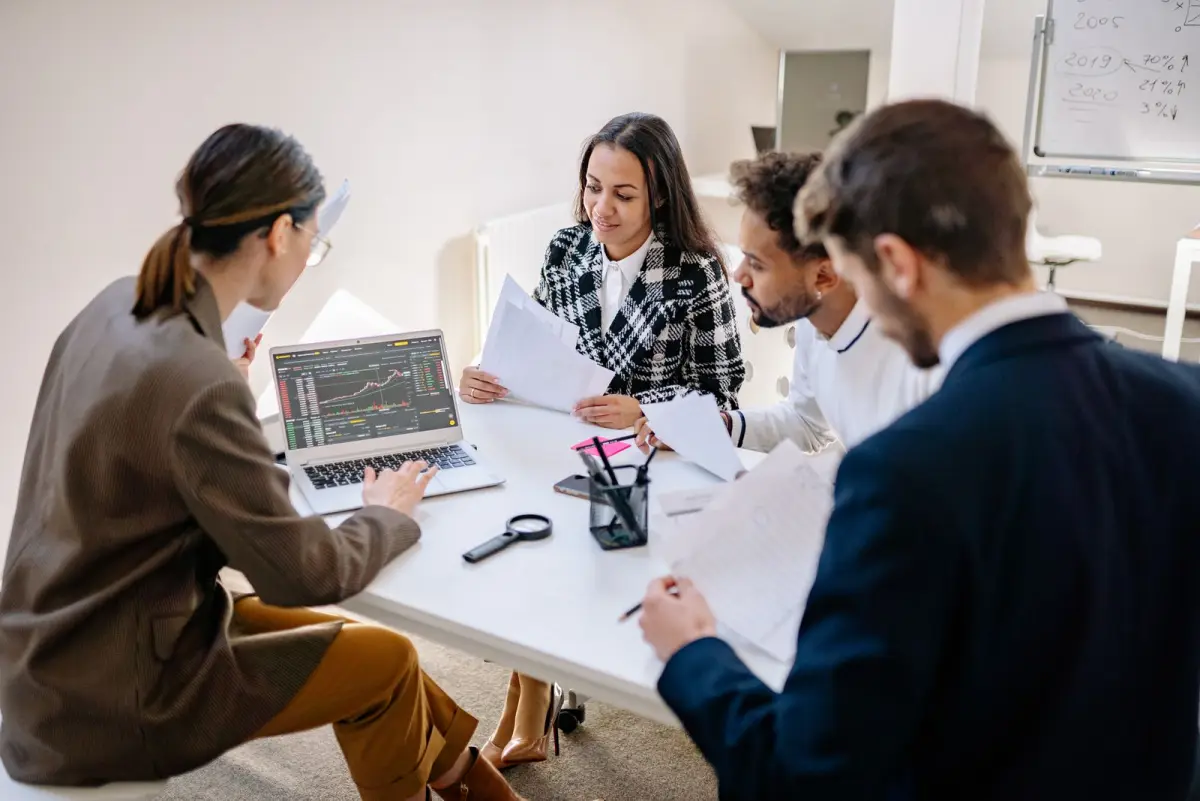 A team reviewing marketing results on a laptop